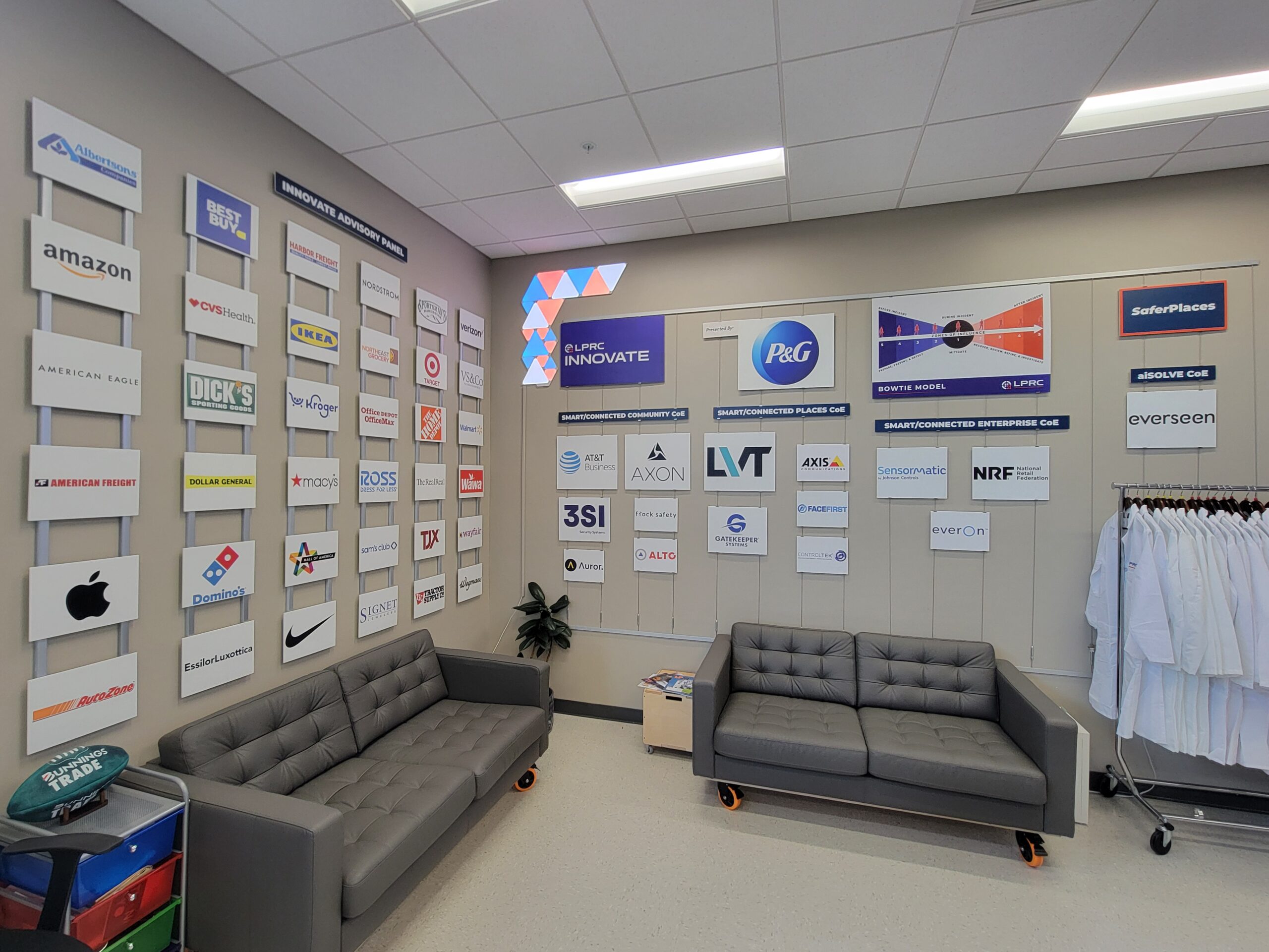LPRC Lab space with logos on wall and couches to sit on